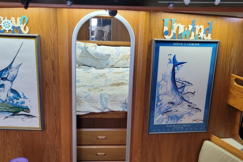 Slide: The Image of Cozy cabin interior of 1992 Luhrs 380 Open with marine-themed decor and artwork. - 27