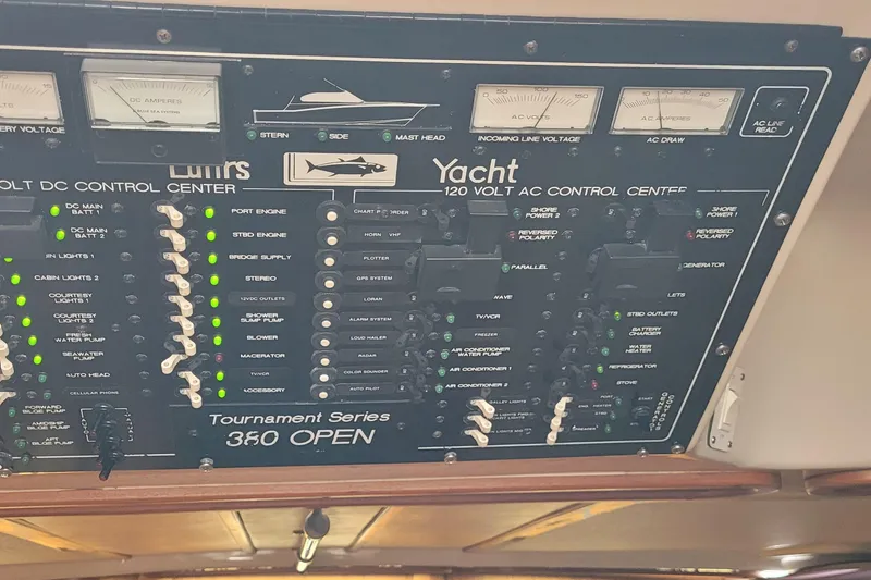Slide: The Image of Control panel of a 1992 Luhrs 380 Open yacht, displaying various switches and indicators. - 28