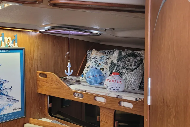 Slide: The Image of Cozy cabin interior of 1992 Luhrs 380 Open with nautical decor and cushions. - 29