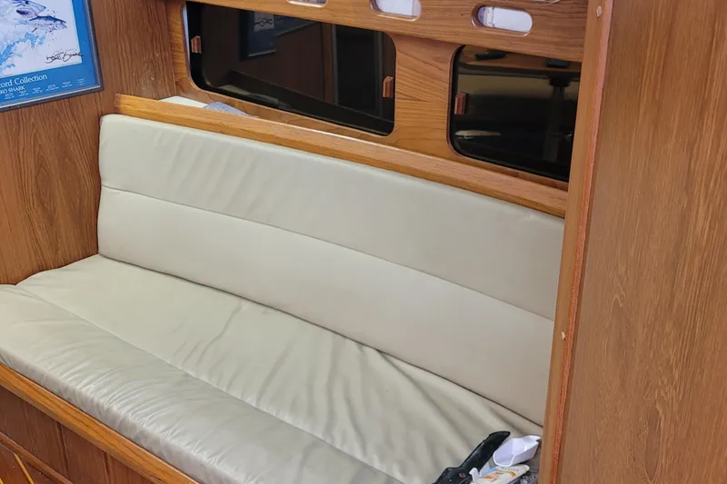 Slide: The Image of Interior of 1992 Luhrs 380 Open boat with cushioned seating and wooden paneling. - 32