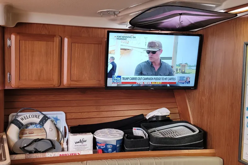 Slide: The Image of Interior of 1992 Luhrs 380 Open boat with TV and storage area. - 33