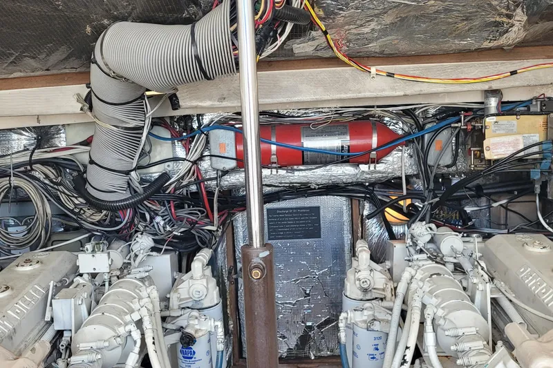 Slide: The Image of Engine room of 1992 Luhrs 380 Open boat with visible wiring and components. - 39