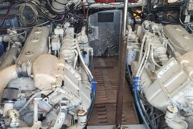 Slide: The Image of Engine room of a 1992 Luhrs 380 Open boat, featuring twin diesel engines. - 40