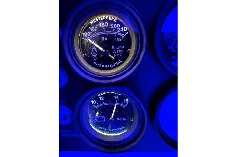 Slide: The Image of Close-up of Luhrs 380 Open 1992 engine gauges illuminated in blue light. - 50