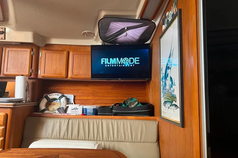 Slide: The Image of Interior of 1992 Luhrs 380 Open boat with TV and wooden cabinetry. - 53