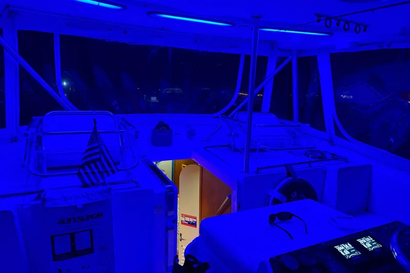 Slide: The Image of 1992 Luhrs 380 Open boat interior with blue lighting and American flag. - 57