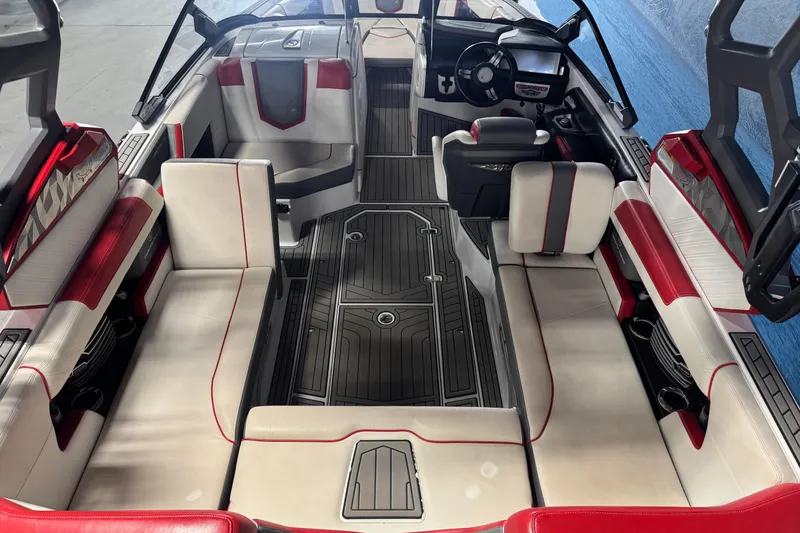 Slide: The Image of 2019 Nautique Super Air Nautique G23 interior with red and white seating, sleek design. - 5