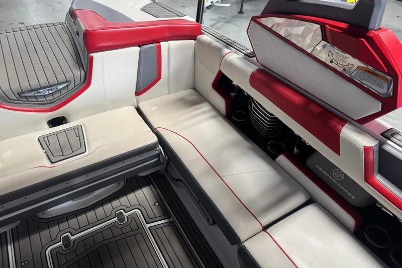 Slide: The Image of 2019 Nautique Super Air Nautique G23 interior with red and white seating. - 8