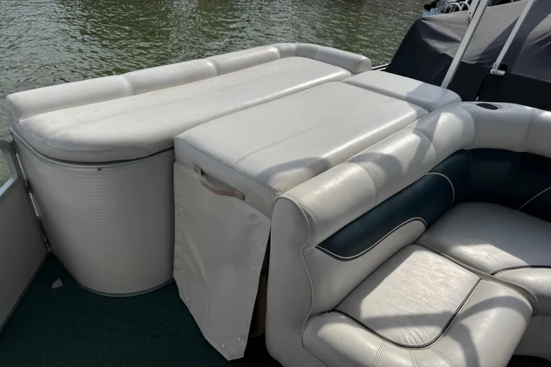 Slide: The Image of Premier 22 boat interior with white leather seating, 2007 model, on water. - 16