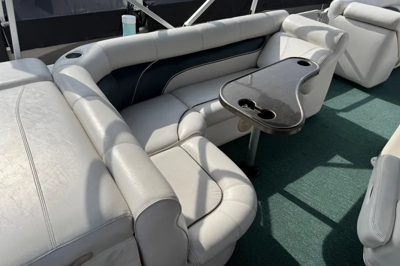 Slide: The Image of Luxurious seating area on a 2007 Premier 22 boat with a stylish table. - 17