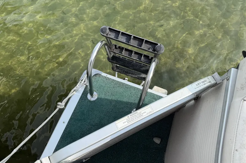 Slide: The Image of Boat ladder on Premier 22, 2007 model, over clear water. - 20
