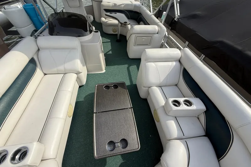 Slide: The Image of Luxurious 2007 Premier 22 boat interior with plush seating and cup holders. - 23