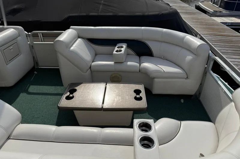 Slide: The Image of Luxurious seating area on a 2007 Premier 22 boat with cup holders and table. - 27