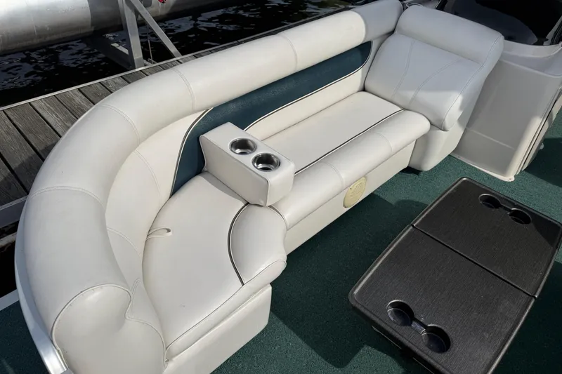 Slide: The Image of Luxurious seating on a 2007 Premier 22 boat with cup holders and table. - 4