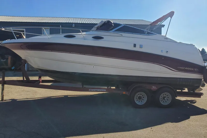 Slide: The Image of 1997 Chaparral Signature 240 boat on trailer, parked outdoors. - 1