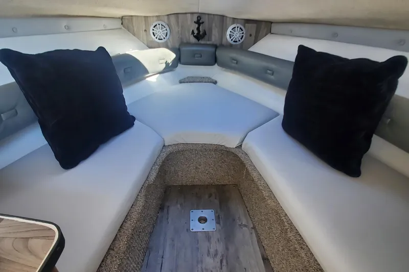 Slide: The Image of 1997 Chaparral Signature 240 cabin interior with cushions and anchor decor. - 16
