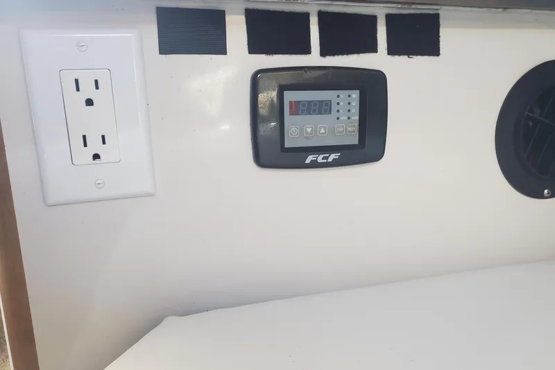 Slide: The Image of 1997 Chaparral Signature 240 interior with outlet and FCF control panel. - 18