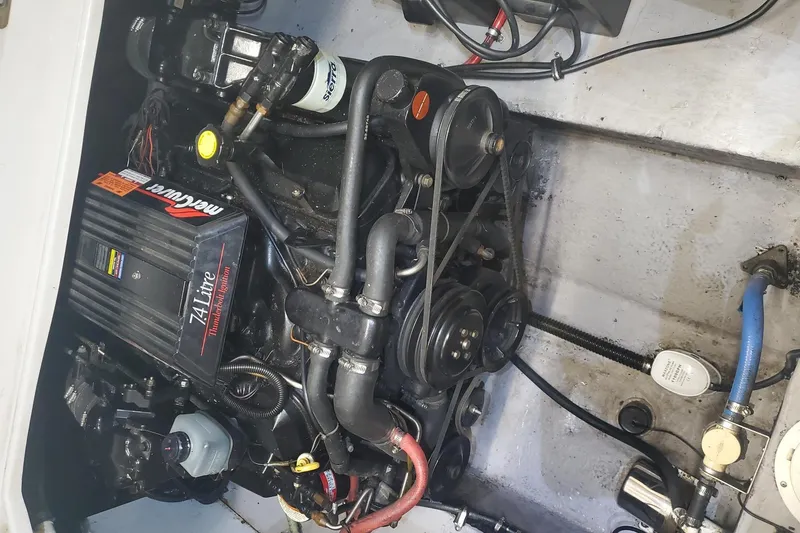 Slide: The Image of Engine compartment of a 1997 Chaparral Signature 240 with a 7.4L MerCruiser engine. - 25
