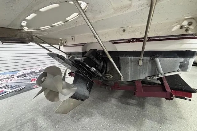 Slide: The Image of 1997 Chaparral Signature 240 boat stern with propeller and outdrive in a showroom. - 29