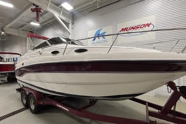 Slide: The Image of 1997 Chaparral Signature 240 boat on trailer in indoor showroom. - 35