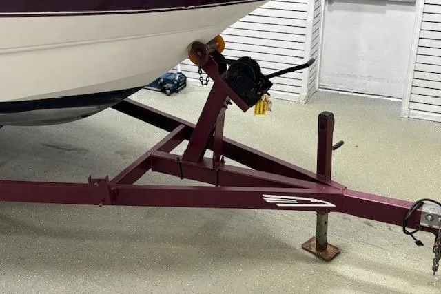Slide: The Image of Trailer hitch of a 1997 Chaparral Signature 240 boat in a garage setting. - 36