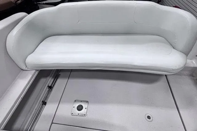 Slide: The Image of 1997 Chaparral Signature 240 boat interior with white cushioned seating. - 37