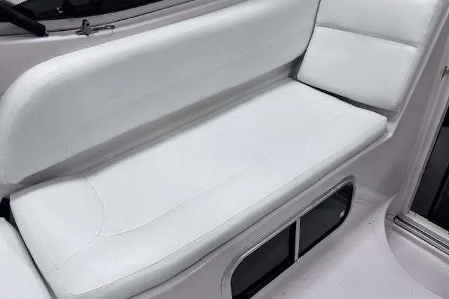 Slide: The Image of White seating area on a 1997 Chaparral Signature 240 boat interior. - 38