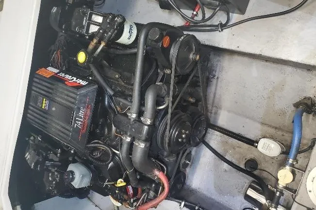 Slide: The Image of Engine of a 1997 Chaparral Signature 240 boat, featuring MerCruiser components. - 6