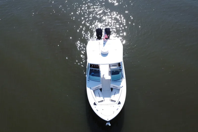 Slide: The Image of Aerial view of 2021 Blackfin 252 DC boat on sparkling water. - 17