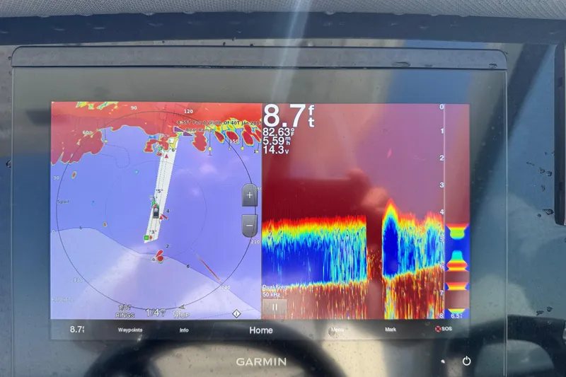 Slide: The Image of Garmin marine display on 2021 Blackfin 252 DC showing sonar and navigation data. - 26