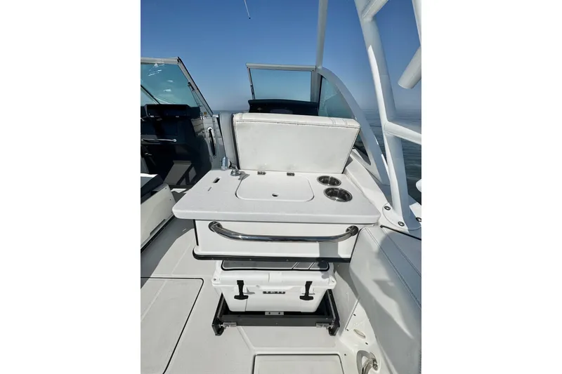 Slide: The Image of 2021 Blackfin 252 DC boat interior with seating and storage compartments. - 33