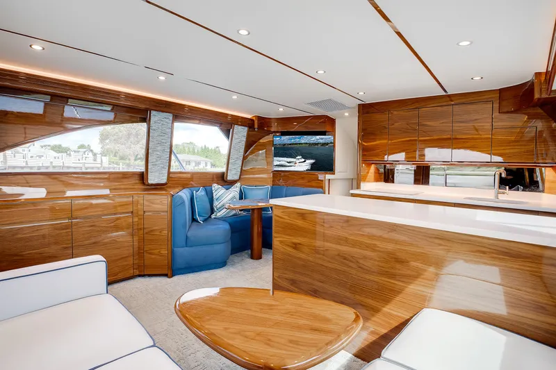 Slide: The Image of Luxurious interior of 2025 Viking 48 Convertible yacht with sleek wood finishes and modern design. - 20