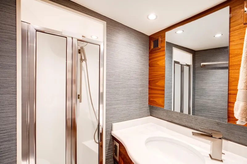 Slide: The Image of Luxurious bathroom in 2025 Viking 48 Convertible yacht with modern shower and sleek design. - 27