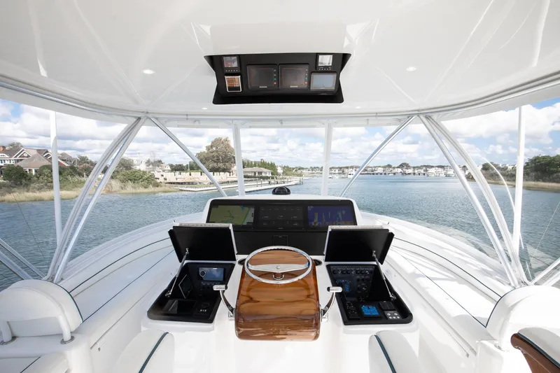 Slide: The Image of Helm of 2025 Viking 48 Convertible yacht with advanced navigation systems. - 33