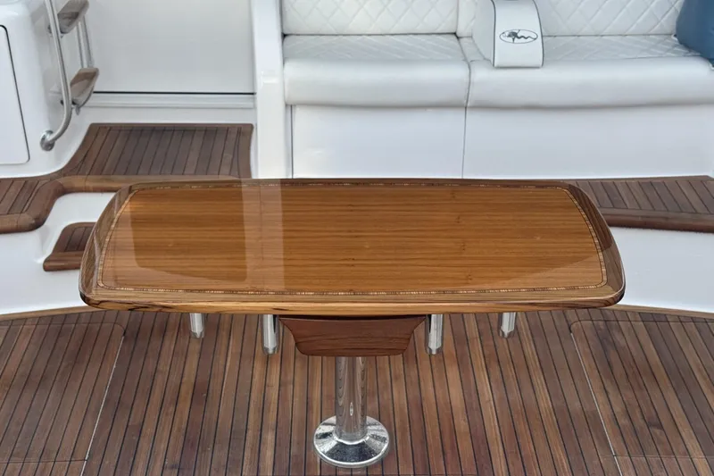 Slide: The Image of Luxurious wooden table on 2025 Viking 48 Convertible yacht deck. - 40