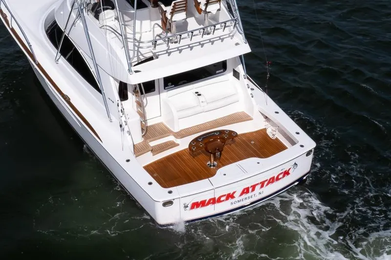 Slide: The Image of 2025 Viking 48 Convertible yacht on water, featuring spacious deck and elegant design. - 41