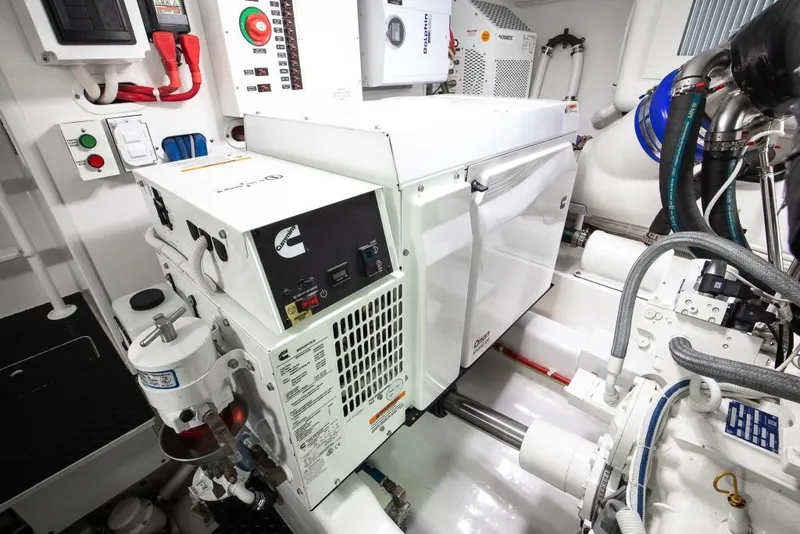 Slide: The Image of Engine room of 2025 Viking 48 Convertible yacht with Cummins generator and control panels. - 45