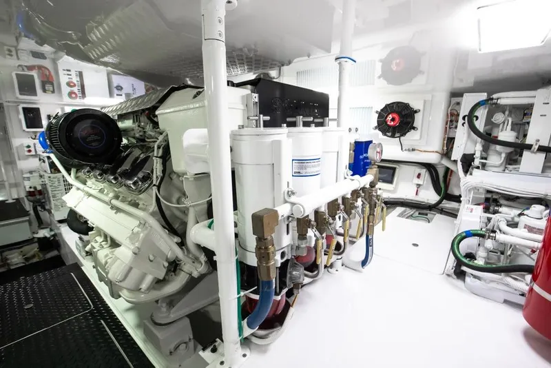 Slide: The Image of Engine room of 2025 Viking 48 Convertible yacht, showcasing advanced machinery and systems. - 47