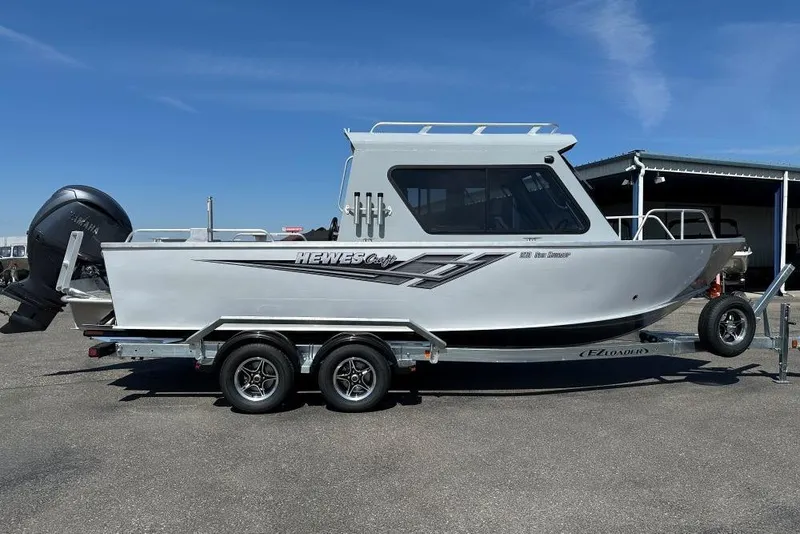Slide: The Image of 2025 Hewescraft 210 Sea Runner ET HT boat on trailer, side view. - 1