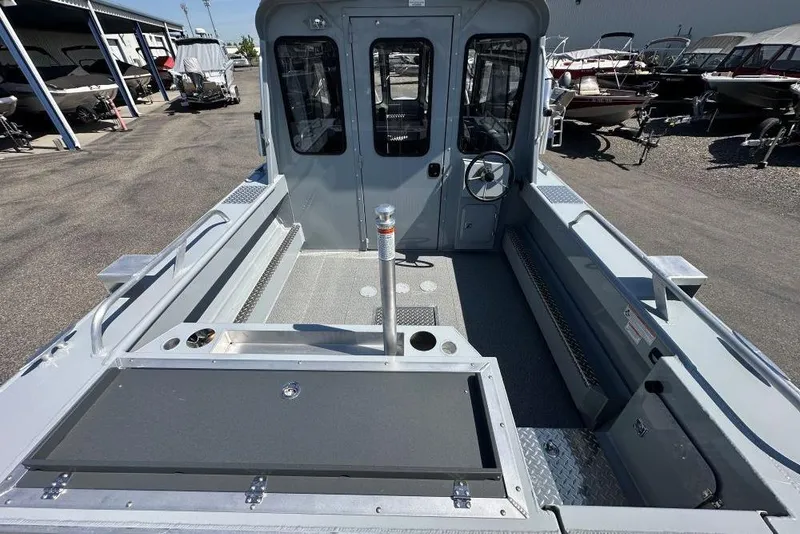 Slide: The Image of 2025 Hewescraft 210 Sea Runner ET HT boat interior, showcasing spacious deck and helm. - 4