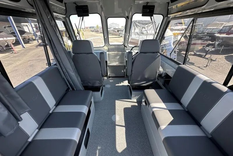 Slide: The Image of Interior of 2025 Hewescraft 210 Sea Runner ET HT boat, featuring spacious seating. - 5