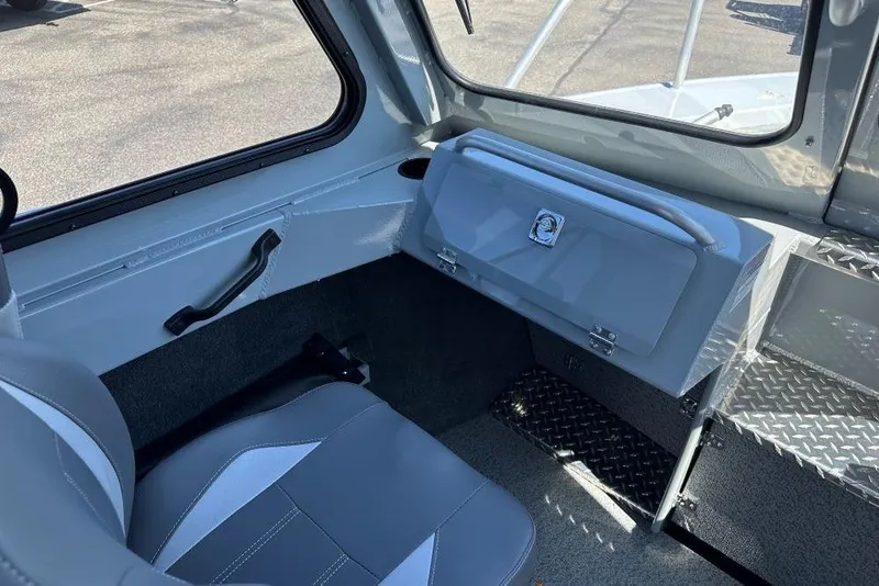 Slide: The Image of Interior of 2025 Hewescraft 210 Sea Runner ET HT boat, featuring seating and storage. - 7