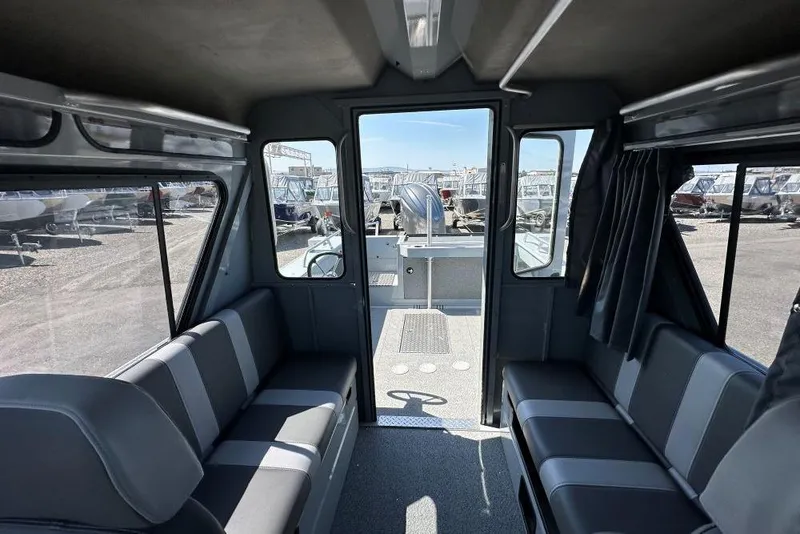 Slide: The Image of Interior of 2025 Hewescraft 210 Sea Runner ET HT boat, featuring spacious seating. - 8