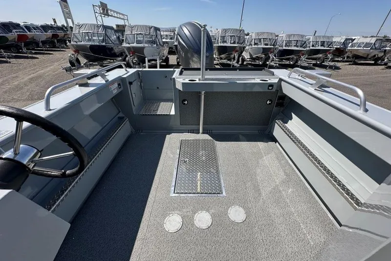 Slide: The Image of 2025 Hewescraft 210 Sea Runner ET HT boat interior, showcasing spacious deck and seating. - 9