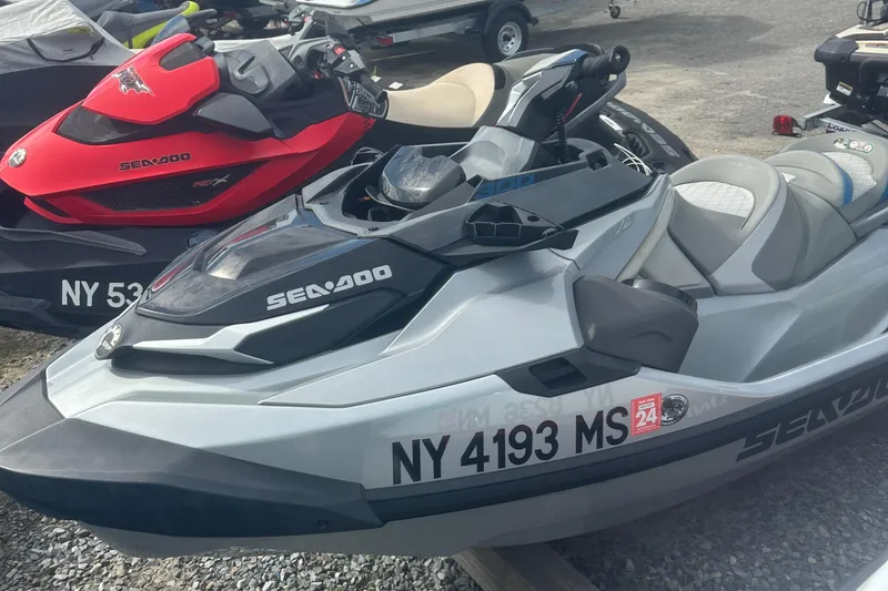 Slide: The Image of 2021 Sea-Doo GTX Limited 300 jet ski in a parking area, featuring sleek design and seating. - 4