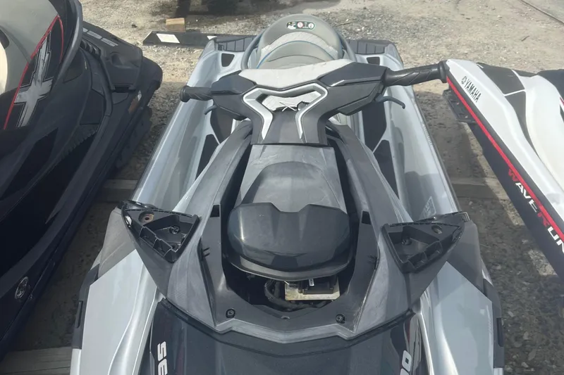 Slide: The Image of 2021 Sea-Doo GTX Limited 300 jet ski, top view, parked outdoors. - 5