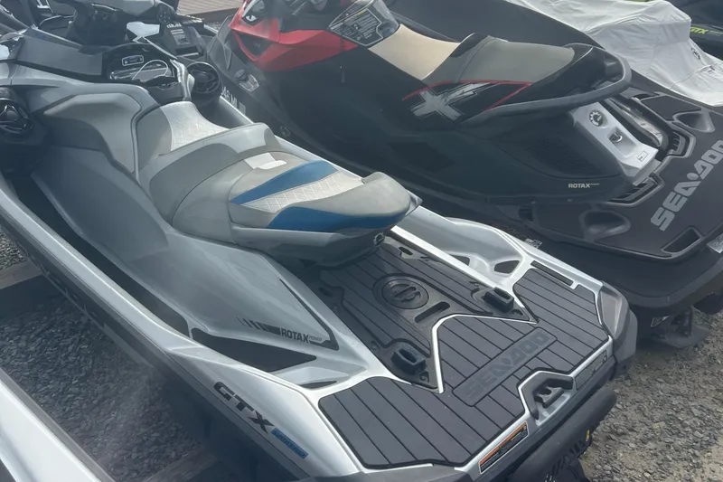 Slide: The Image of 2021 Sea-Doo GTX Limited 300 jet ski in a parking area. - 7
