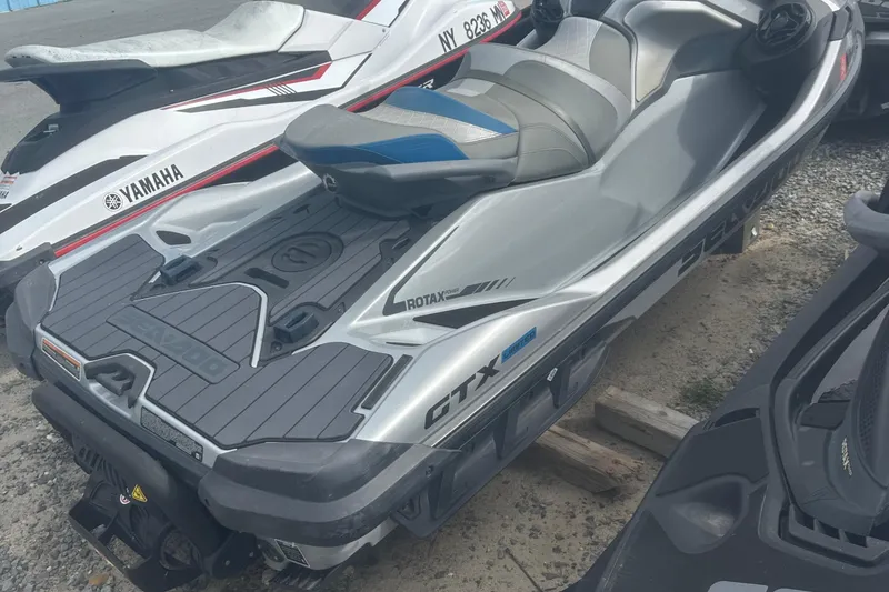 Slide: The Image of 2021 Sea-Doo GTX Limited 300 jet ski parked on gravel. - 8