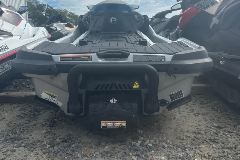 Slide: The Image of 2021 Sea-Doo GTX Limited 300 jet ski rear view on gravel surface. - 9