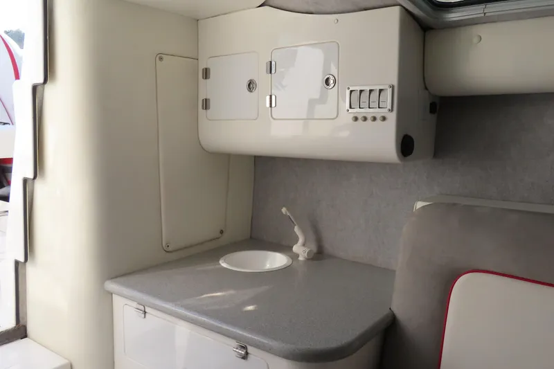 Slide: The Image of 2013 Nordic 39 POKER RUN boat interior with compact sink and storage cabinets. - 29